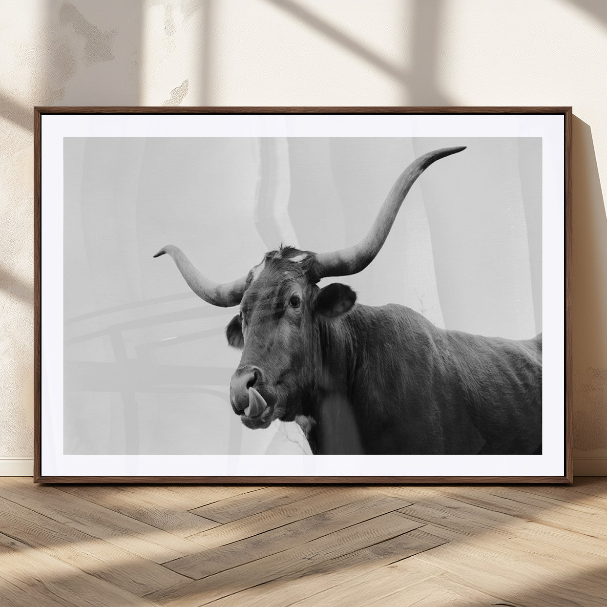 Black and white photo of a Texas Longhorn cow with curved horns, ideal for rustic, western or minimalist style home decor.