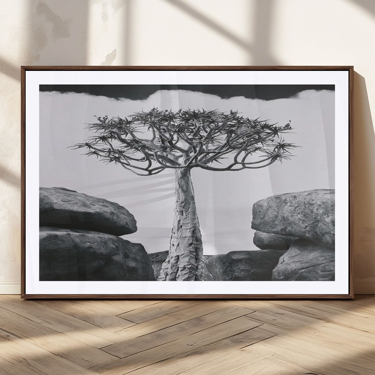 Black and white Joshua tree with bold rocky background, ideal for minimalist or desert-inspired home wall decoration.