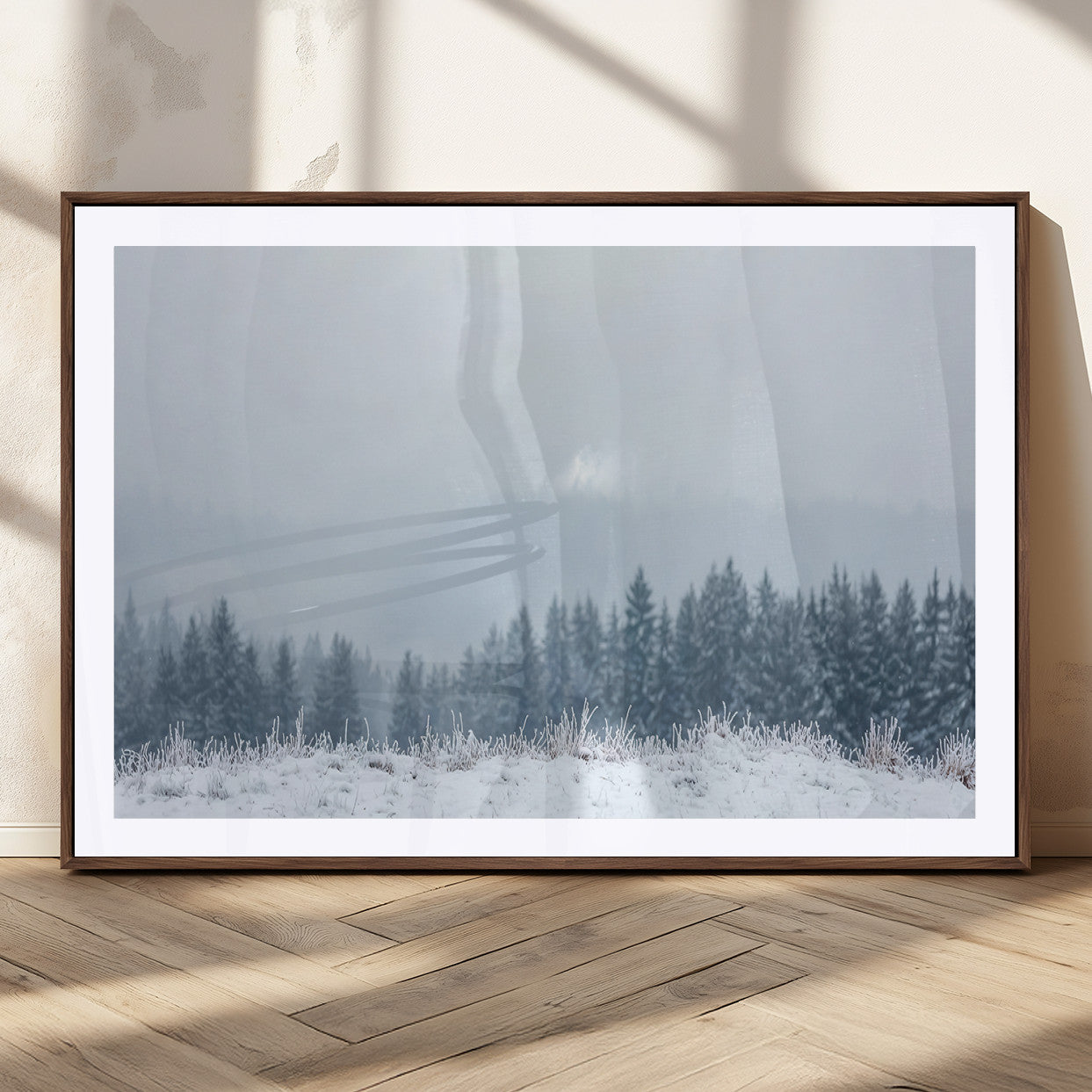 Snow-covered forest under misty sky, soft light breaking through clouds, ideal for minimalist or Nordic-inspired home decor.