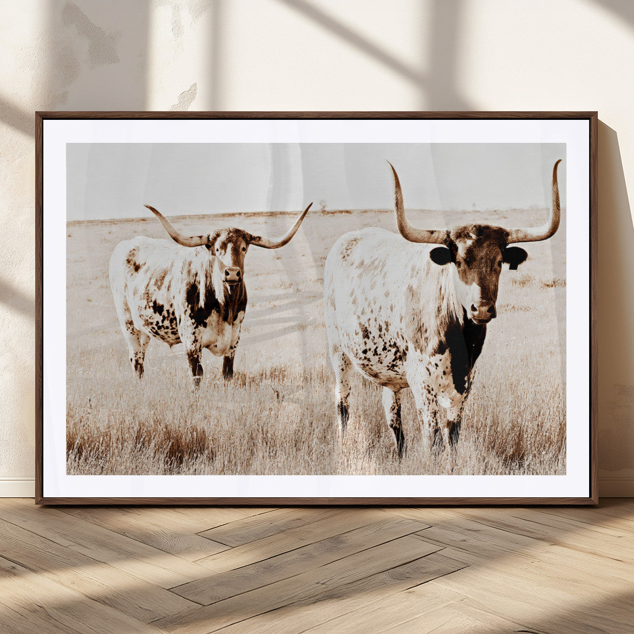 Two Texas longhorn cows standing in a sepia-toned pasture, evoking rustic charm perfect for farmhouse or western country interiors. (