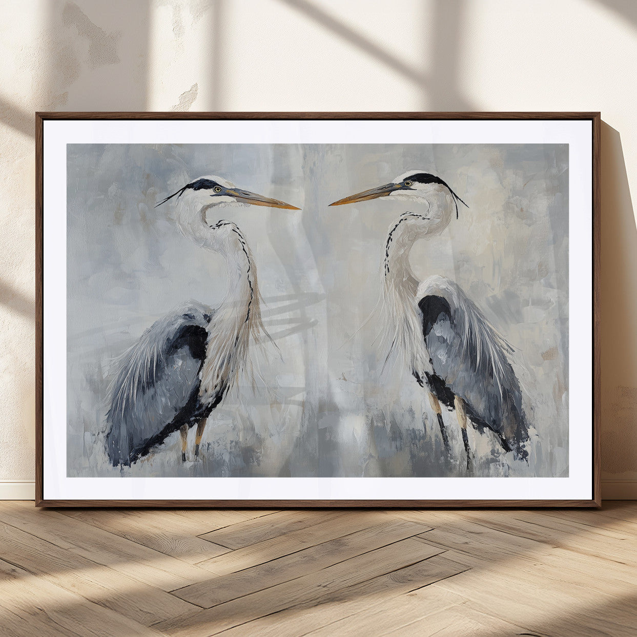 Two herons facing each other on a soft-toned background with blue-grey feathers, perfect for tranquil, coastal or nature-themed interiors.
