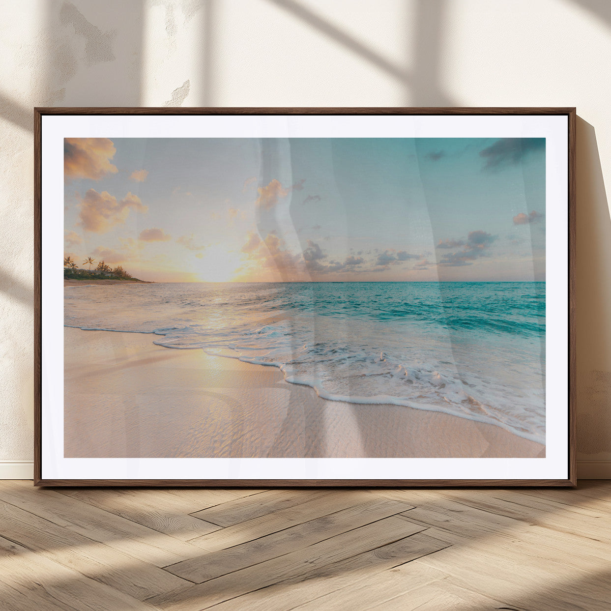 Golden sunset over a tropical beach with gentle ocean waves and soft white sand, creating a peaceful and relaxing coastal scene.