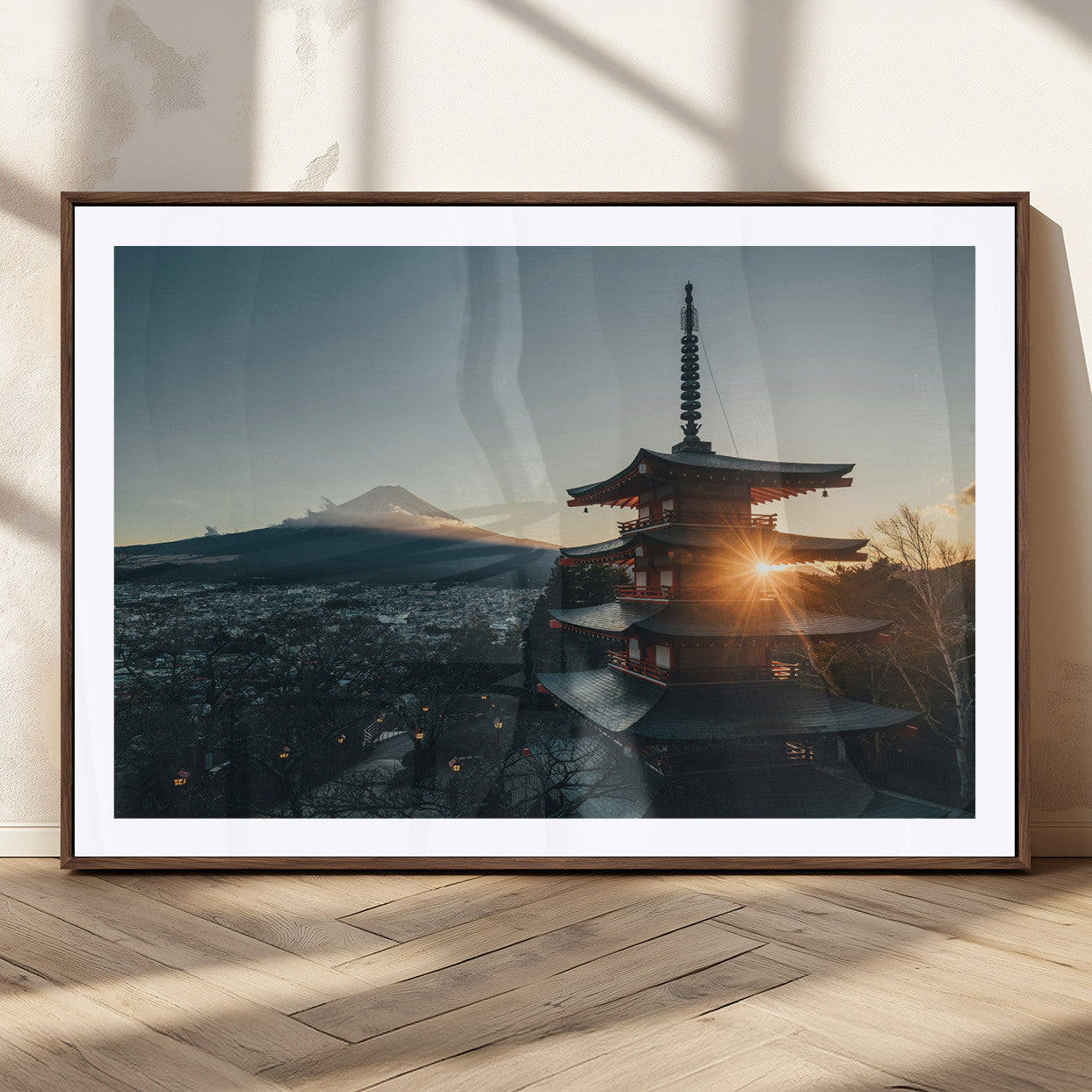 Chureito Pagoda at sunset with Mount Fuji in the background, city lights below, and golden sun rays, ideal for Japanese-inspired wall art.