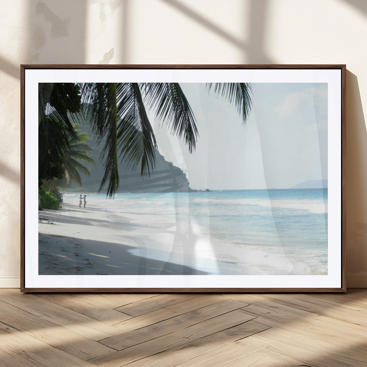 Tropical beach with palm tree shadows, white sand, and turquoise ocean waves, creating a serene and relaxing island escape atmosphere.