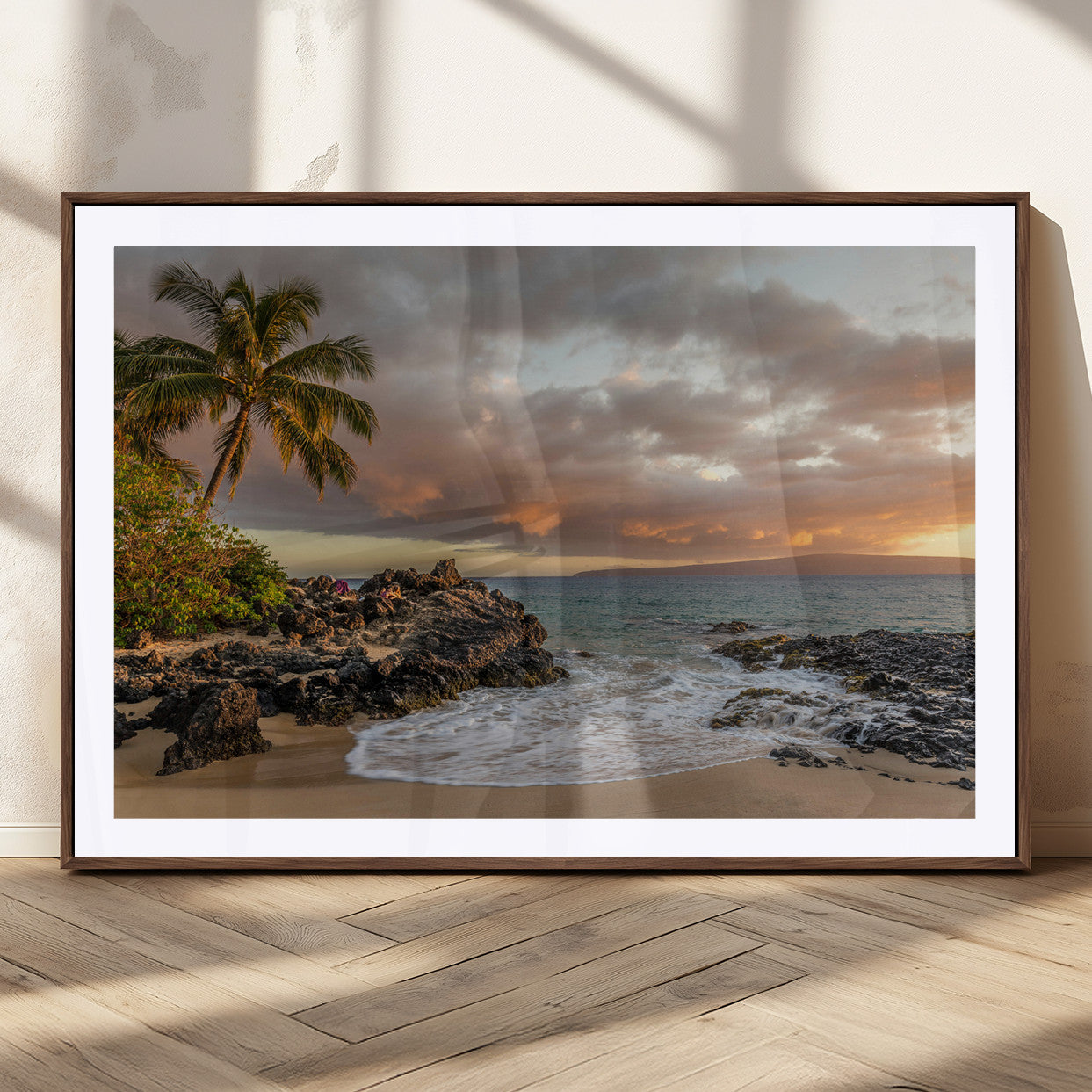 Golden sunset over a tropical beach with palm trees, rocky shoreline, and gentle ocean waves, perfect for coastal and island-inspired decor.