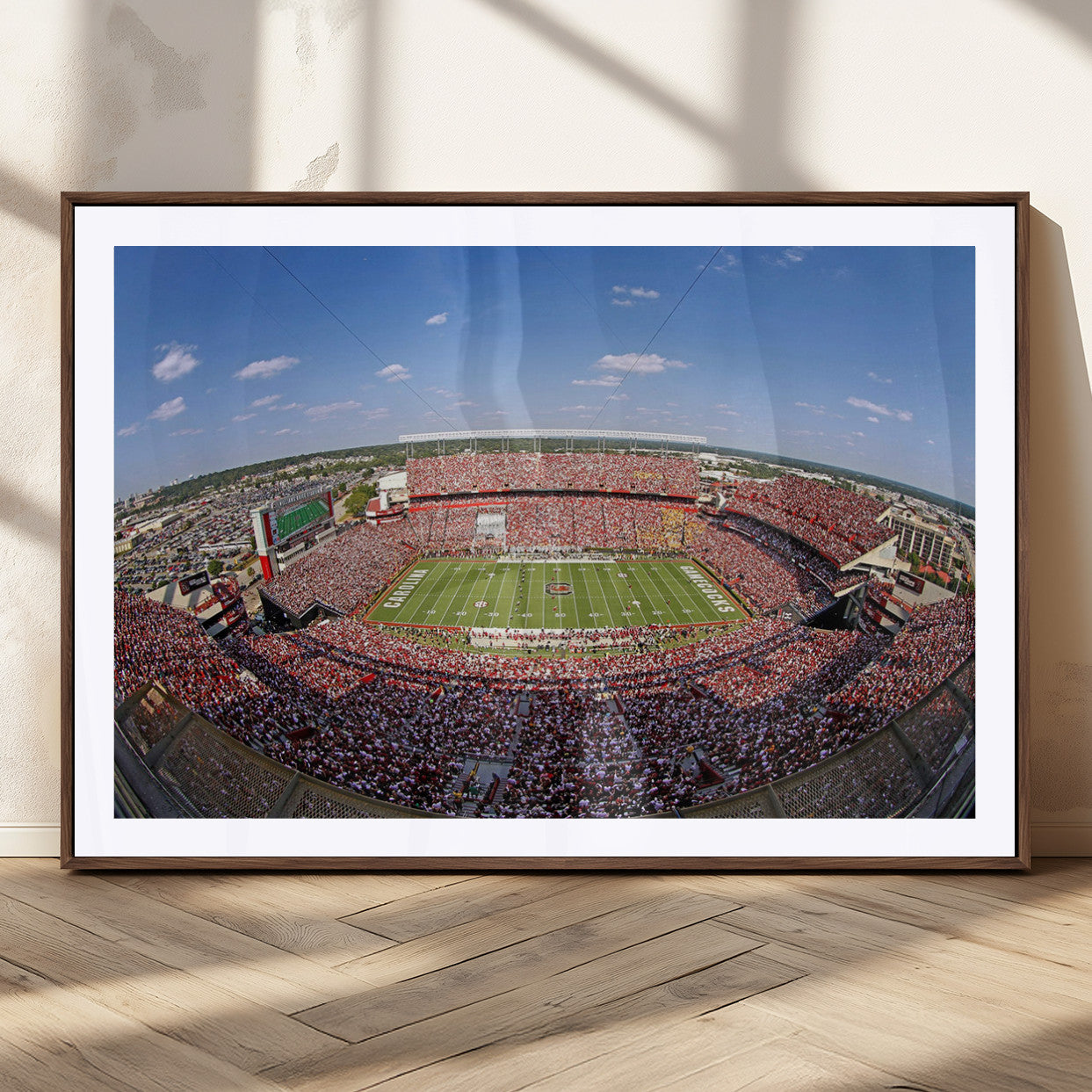 An William Brice-Stadium view of a full football stadium with cheering fans and clear blue skies, capturing the excitement and energy of the game.