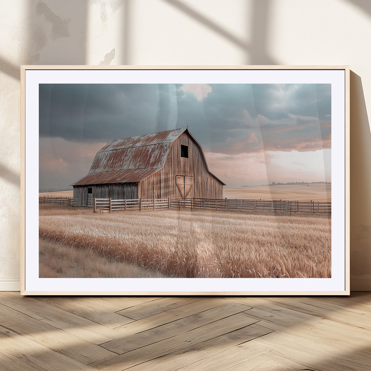 Framed canvas of a rustic barn in a golden wheat field under soft skies, ideal for vintage farmhouse or country-style wall decor.
