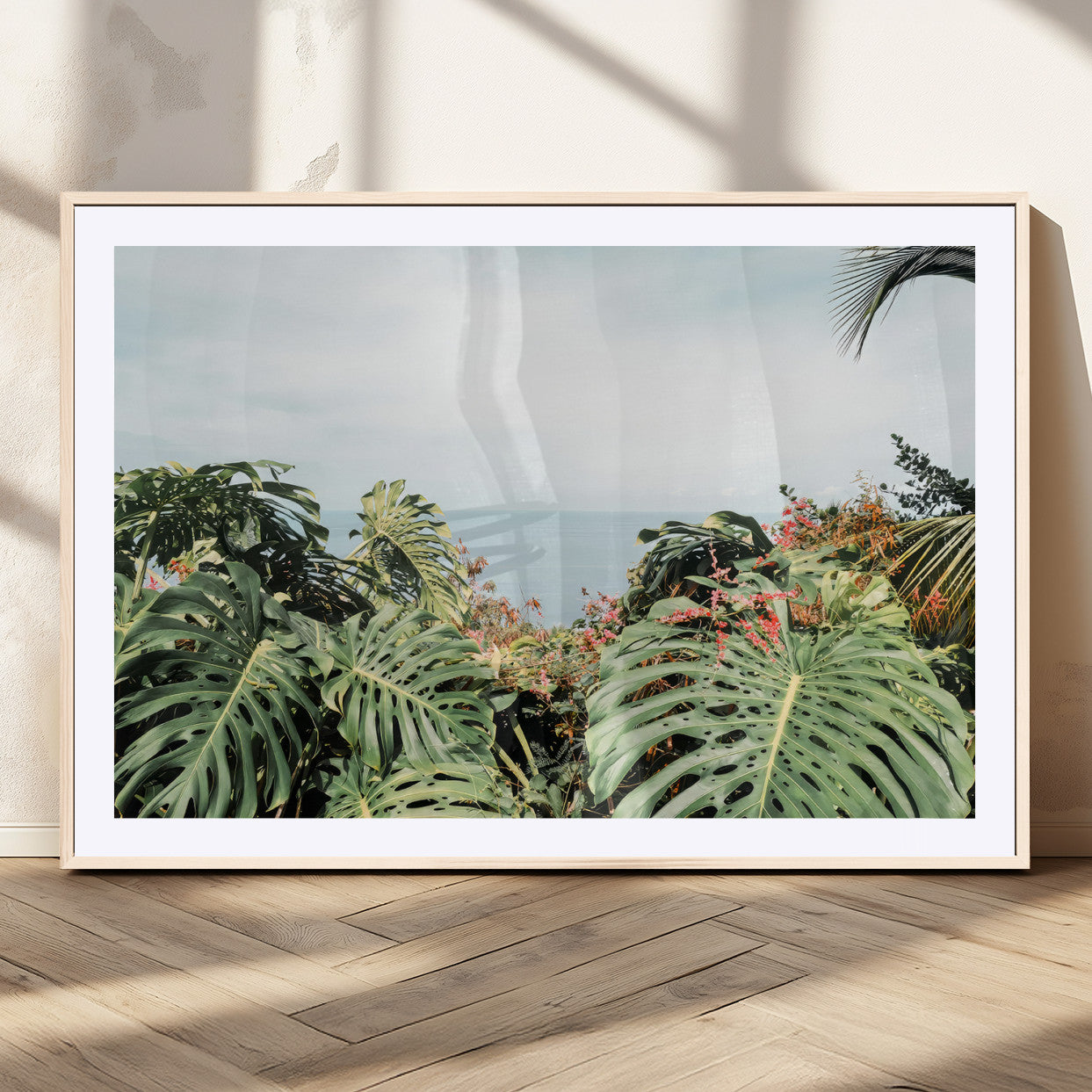 45700479-MGV-CV-36X24 - Tropical Greenery Wall Art – Exotic Leaves & Ocean View Canvas Print, Sunlit Paradise and Vibrant Nature for Living Room or Coastal Decor