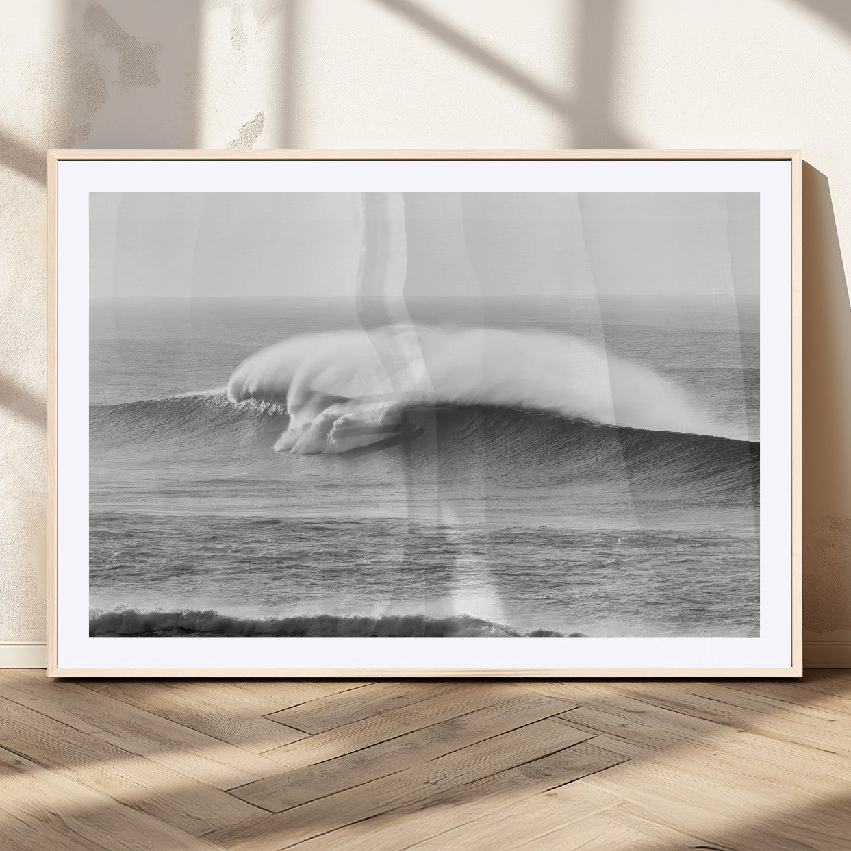 A dramatic black and white ocean wave crashing with immense force, capturing the raw power and movement of the sea in a bold seascape.