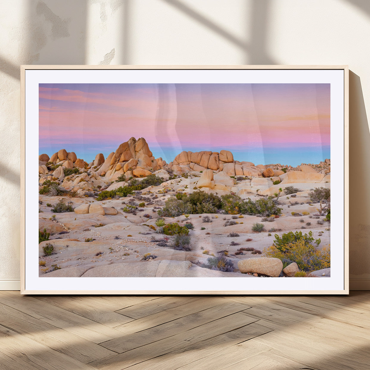 A breathtaking desert landscape featuring rugged rock formations under a vibrant pastel sunset sky, capturing the warmth and serenity of a Southwestern wilderness.