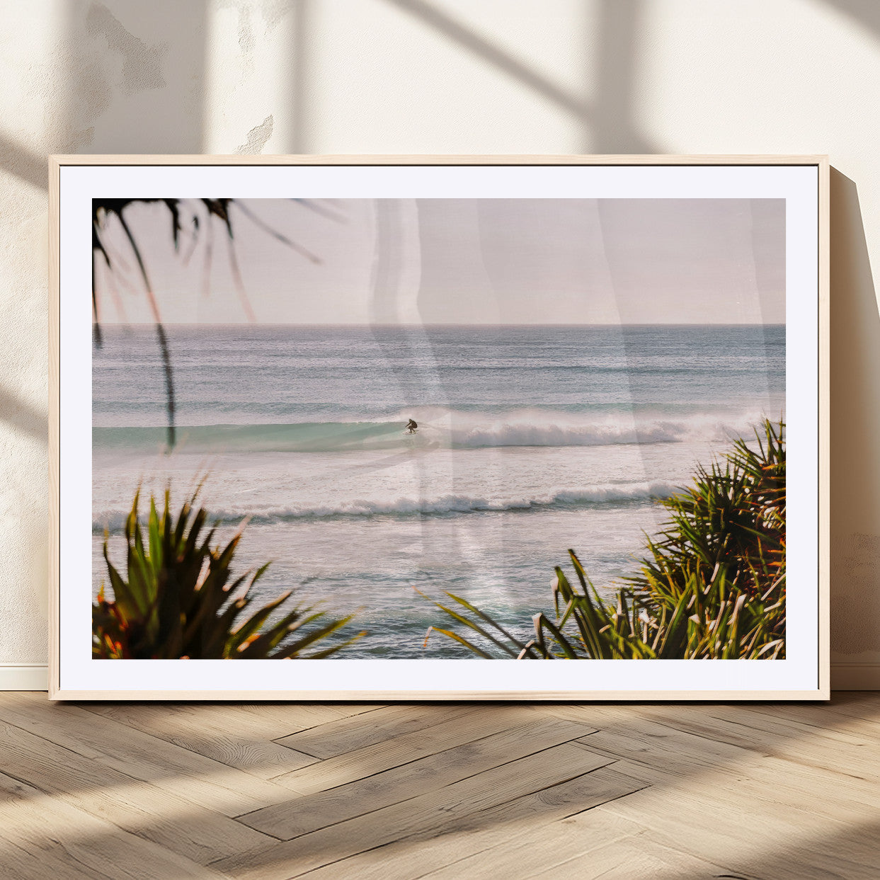 Canvas of a lone surfer riding a pastel wave at sunrise, perfect for tropical or coastal-themed spaces with a relaxed, airy vibe.