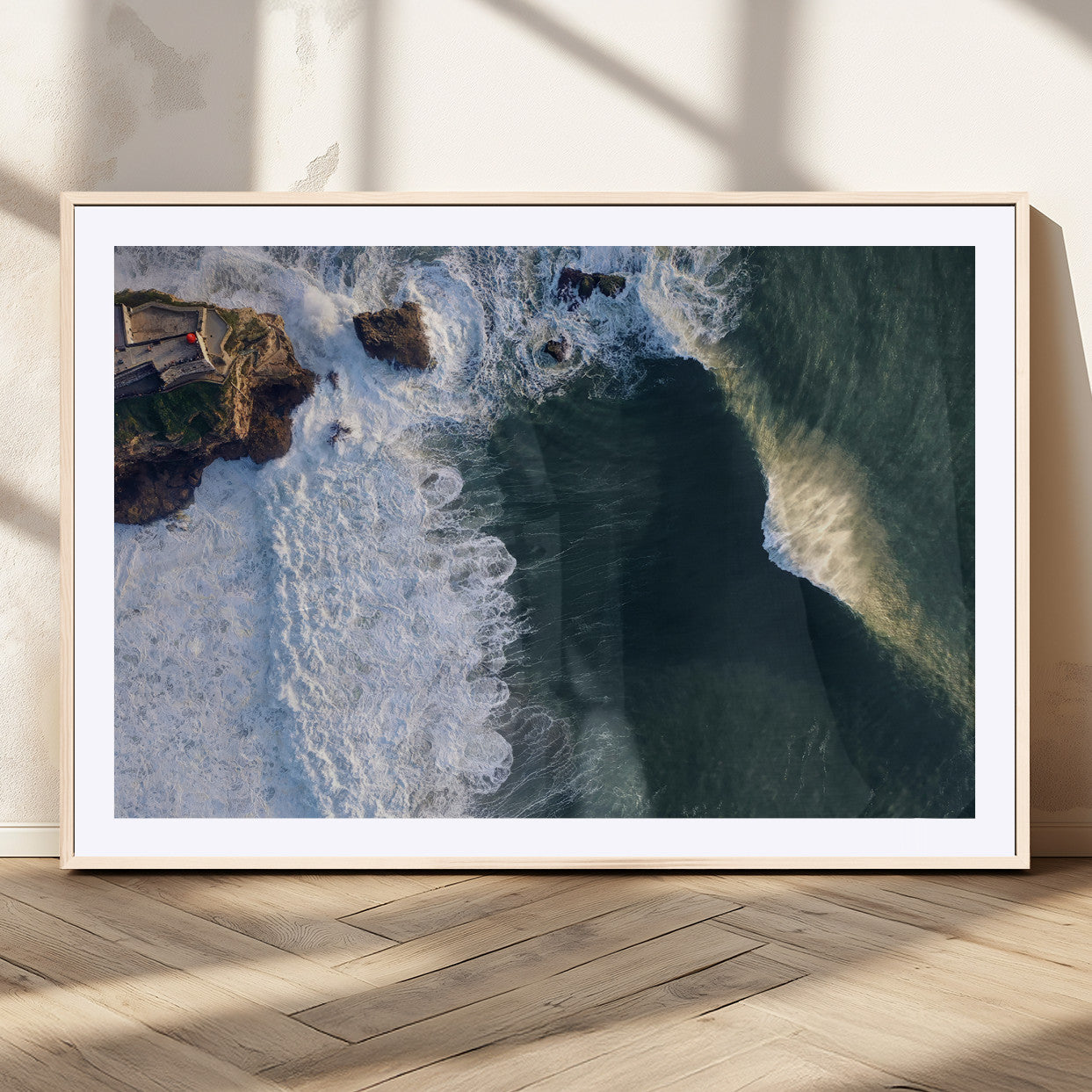 Canvas showing an aerial view of crashing waves along the Nazaré coastline, perfect for dramatic coastal or ocean-themed home decor.