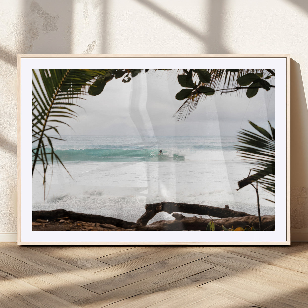Tropical beach view with palm trees and surfer riding a wave, perfect for boho or coastal-inspired interior wall decor.