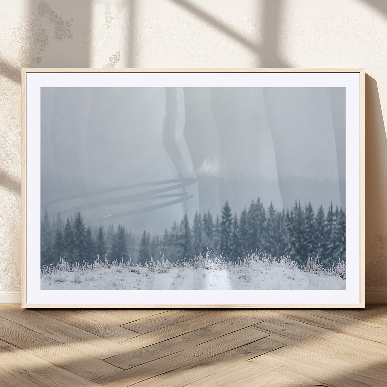 Snow-covered forest under misty sky, soft light breaking through clouds, ideal for minimalist or Nordic-inspired home decor.