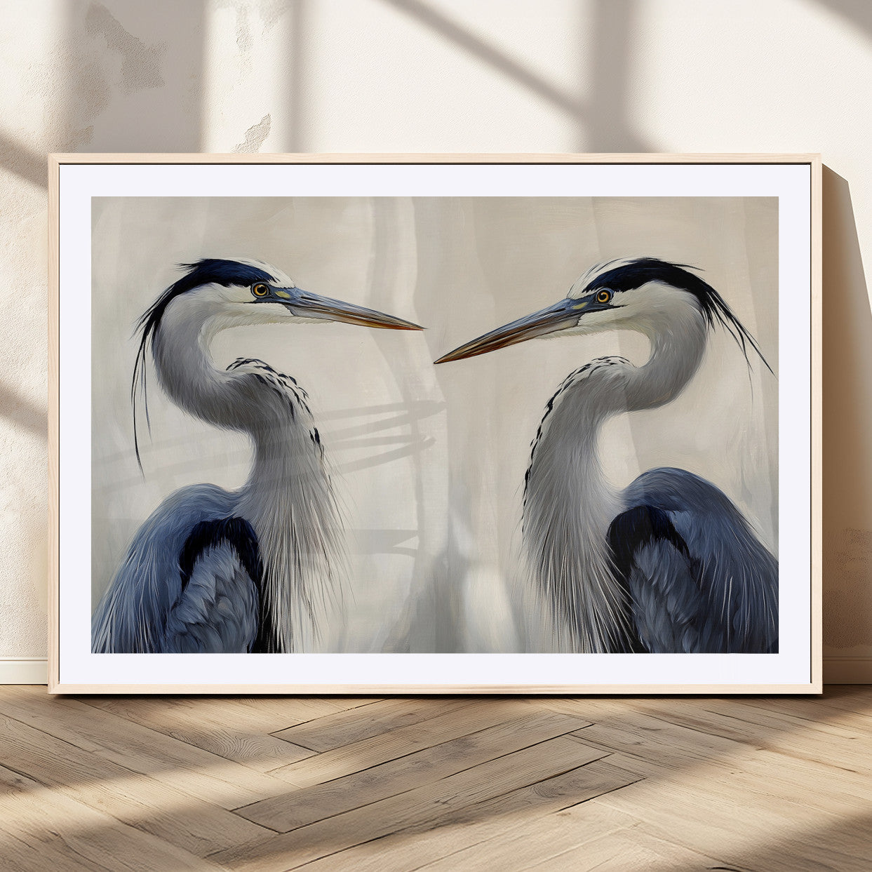 Two blue herons facing each other on a soft neutral background, ideal for coastal, tranquil, or nature-inspired minimalist interiors.