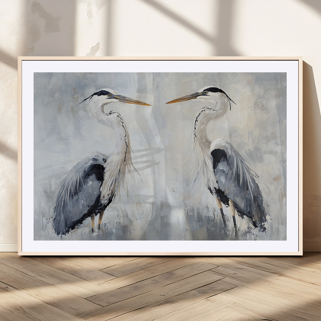 Two herons facing each other on a soft-toned background with blue-grey feathers, perfect for tranquil, coastal or nature-themed interiors.