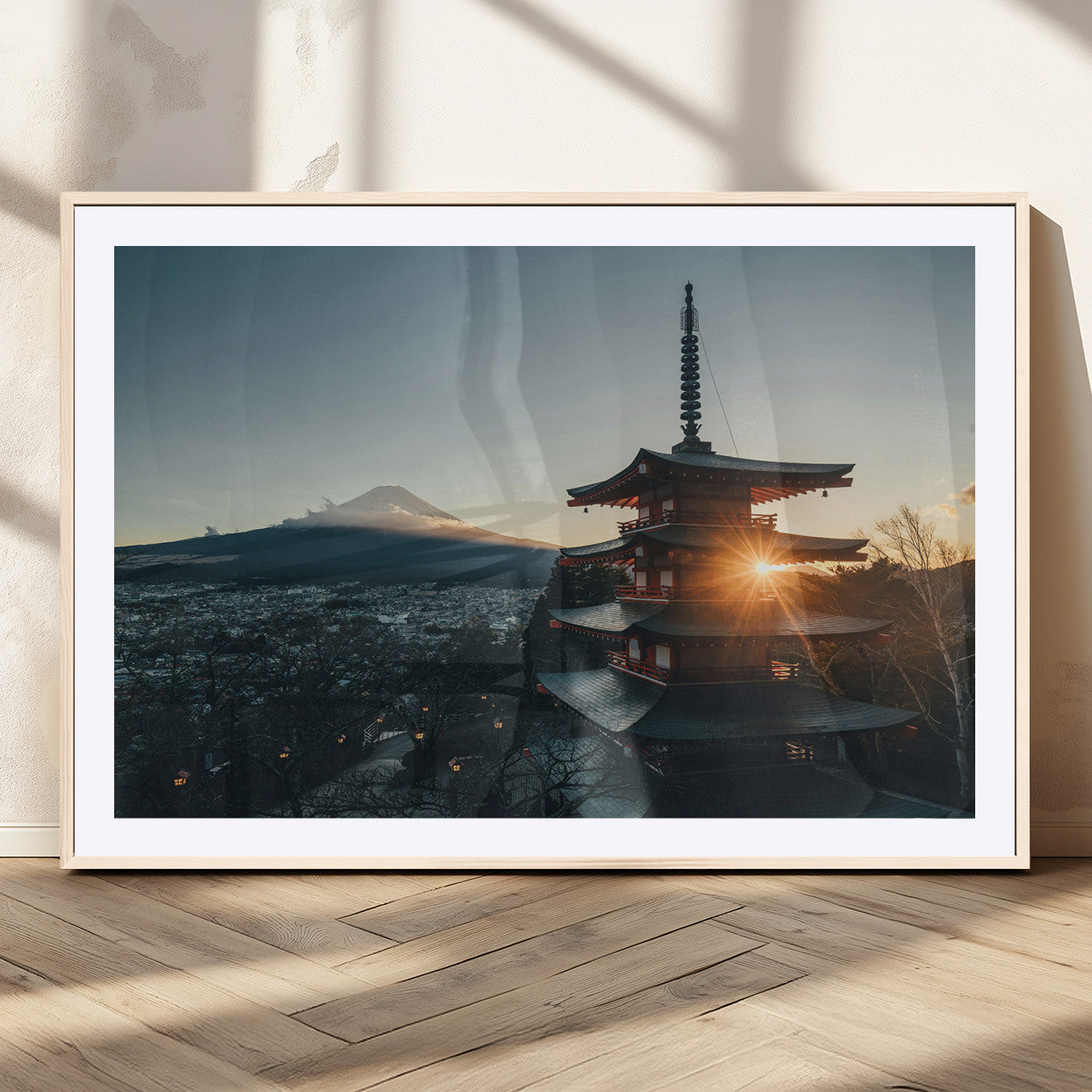 Chureito Pagoda at sunset with Mount Fuji in the background, city lights below, and golden sun rays, ideal for Japanese-inspired wall art.