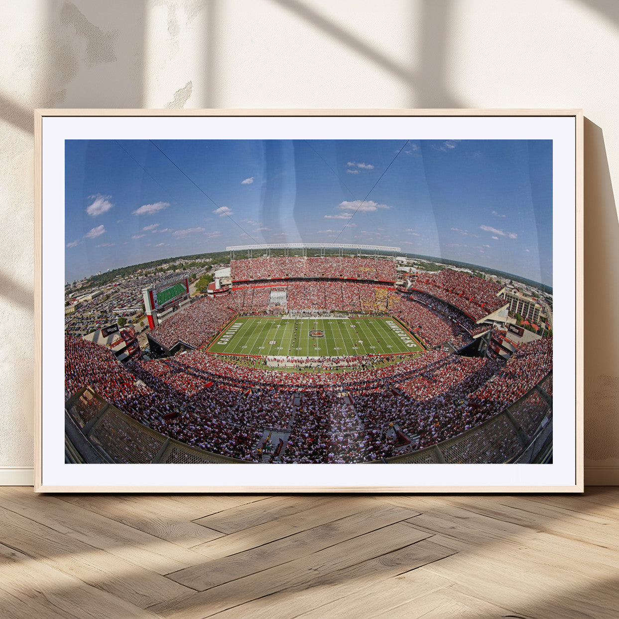 An William Brice-Stadium view of a full football stadium with cheering fans and clear blue skies, capturing the excitement and energy of the game.