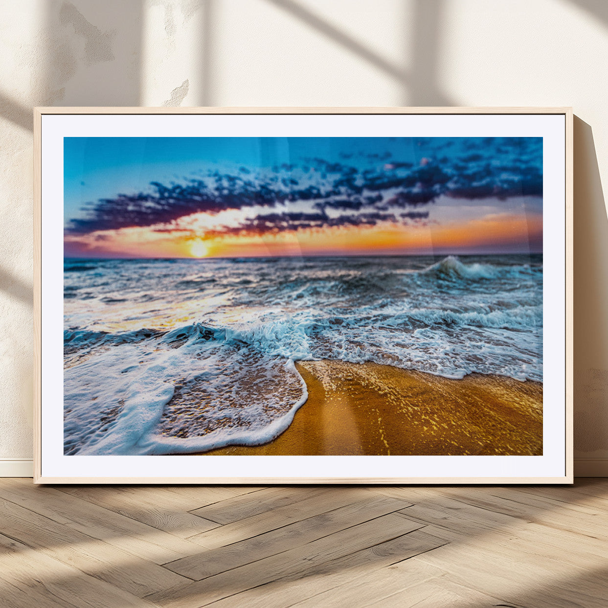 Beautiful ocean shoreline at sunset with foamy waves washing onto golden sand under a colorful sky – Wall Art Canvas Print.