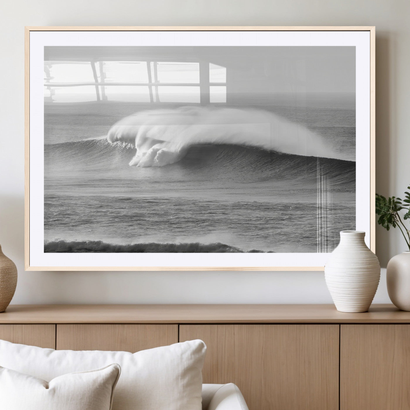 A dramatic black and white ocean wave crashing with immense force, capturing the raw power and movement of the sea in a bold seascape.