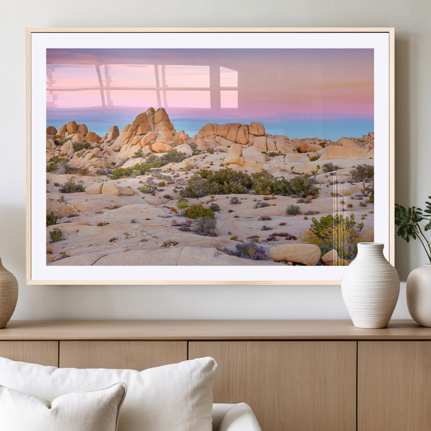 A breathtaking desert landscape featuring rugged rock formations under a vibrant pastel sunset sky, capturing the warmth and serenity of a Southwestern wilderness.