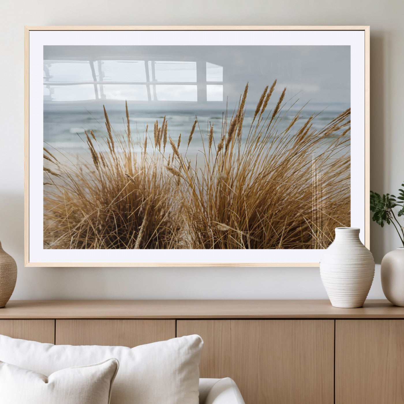 Canvas of golden beach grass swaying by the ocean under a soft cloudy sky, perfect for neutral-toned or coastal minimalist decor.