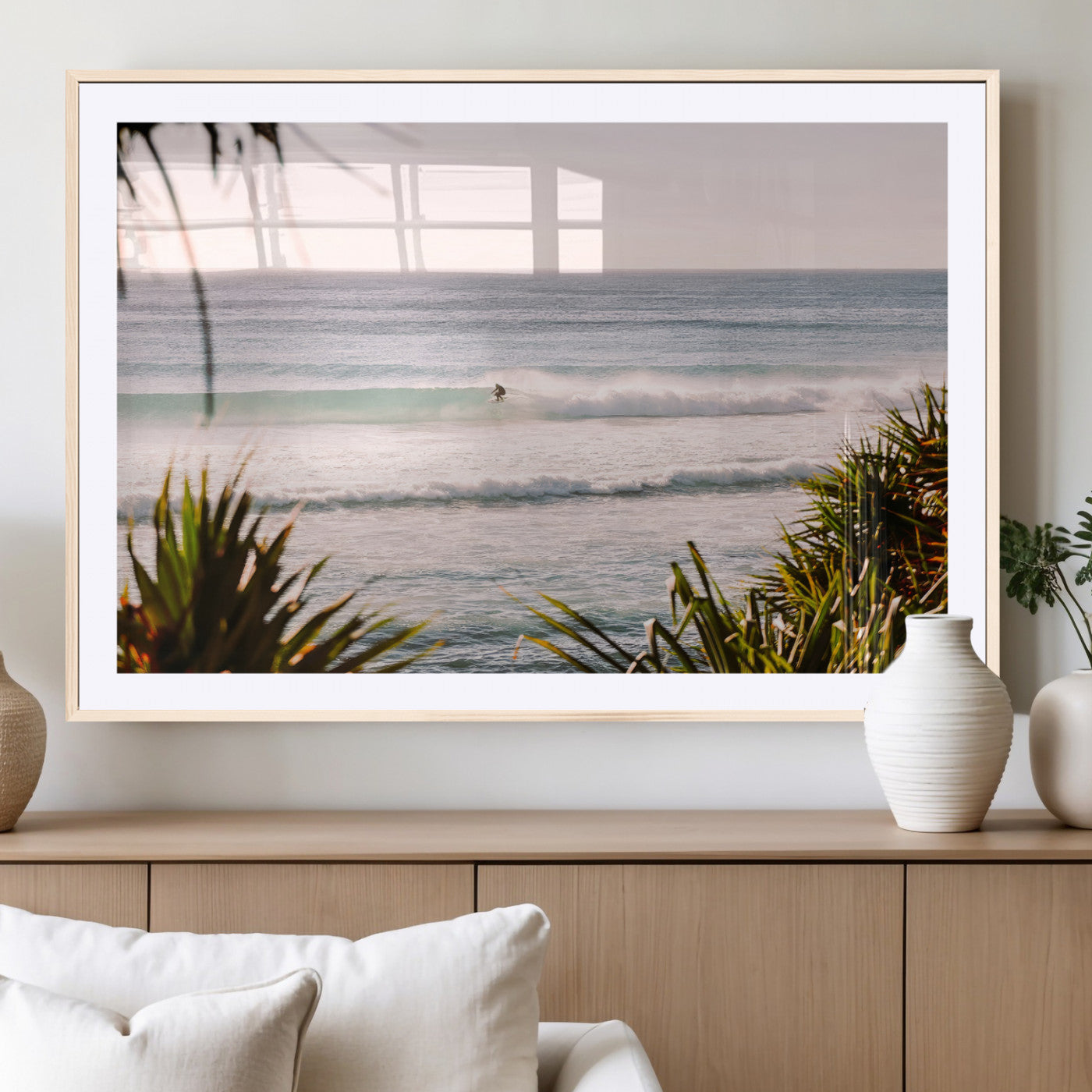 Canvas of a lone surfer riding a pastel wave at sunrise, perfect for tropical or coastal-themed spaces with a relaxed, airy vibe.