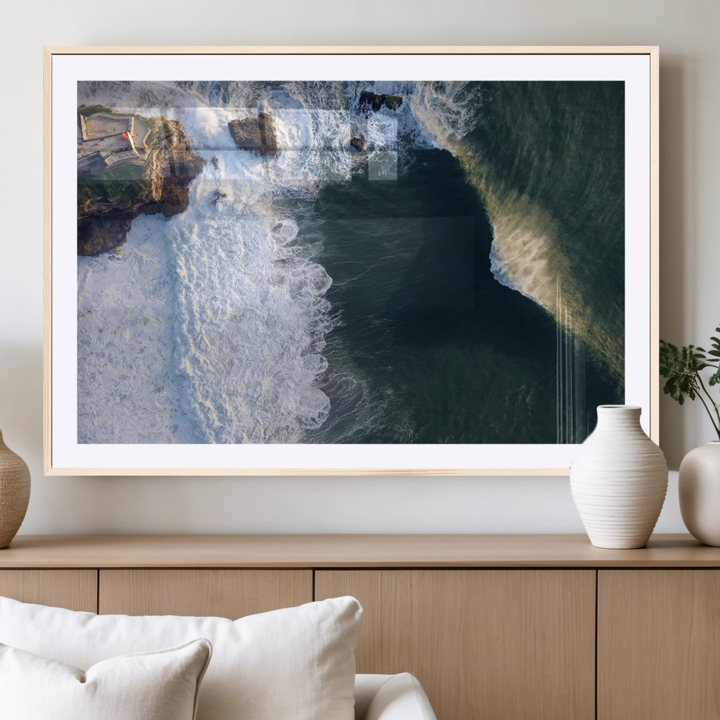 Canvas showing an aerial view of crashing waves along the Nazaré coastline, perfect for dramatic coastal or ocean-themed home decor.