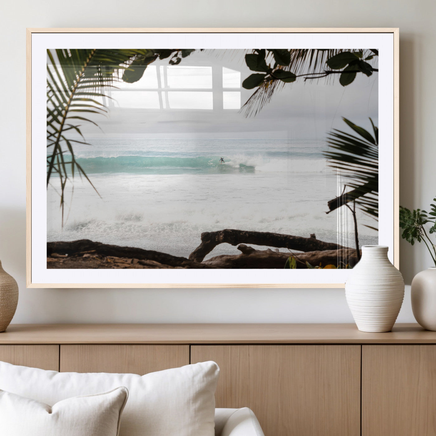 Tropical beach view with palm trees and surfer riding a wave, perfect for boho or coastal-inspired interior wall decor.
