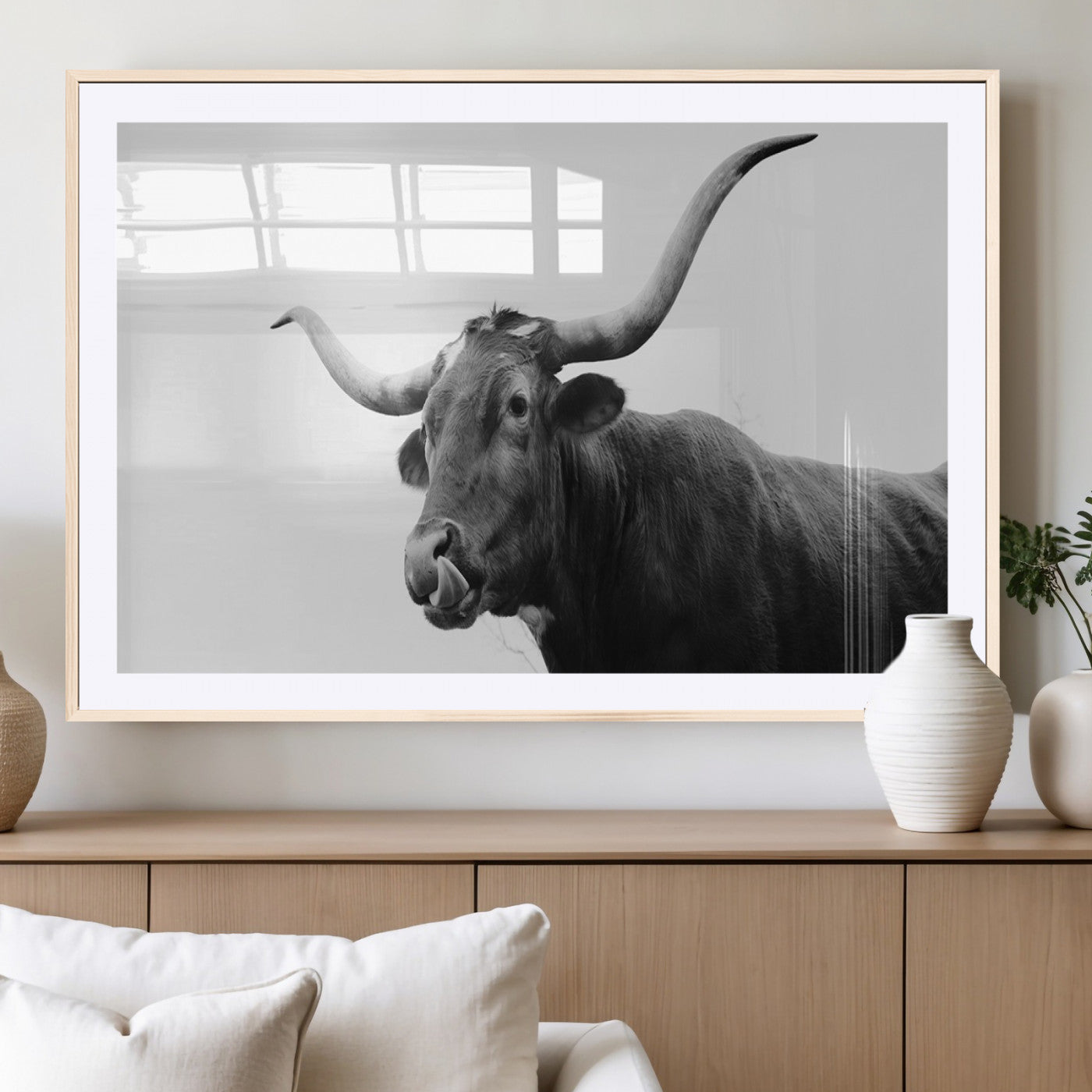 Black and white photo of a Texas Longhorn cow with curved horns, ideal for rustic, western or minimalist style home decor.