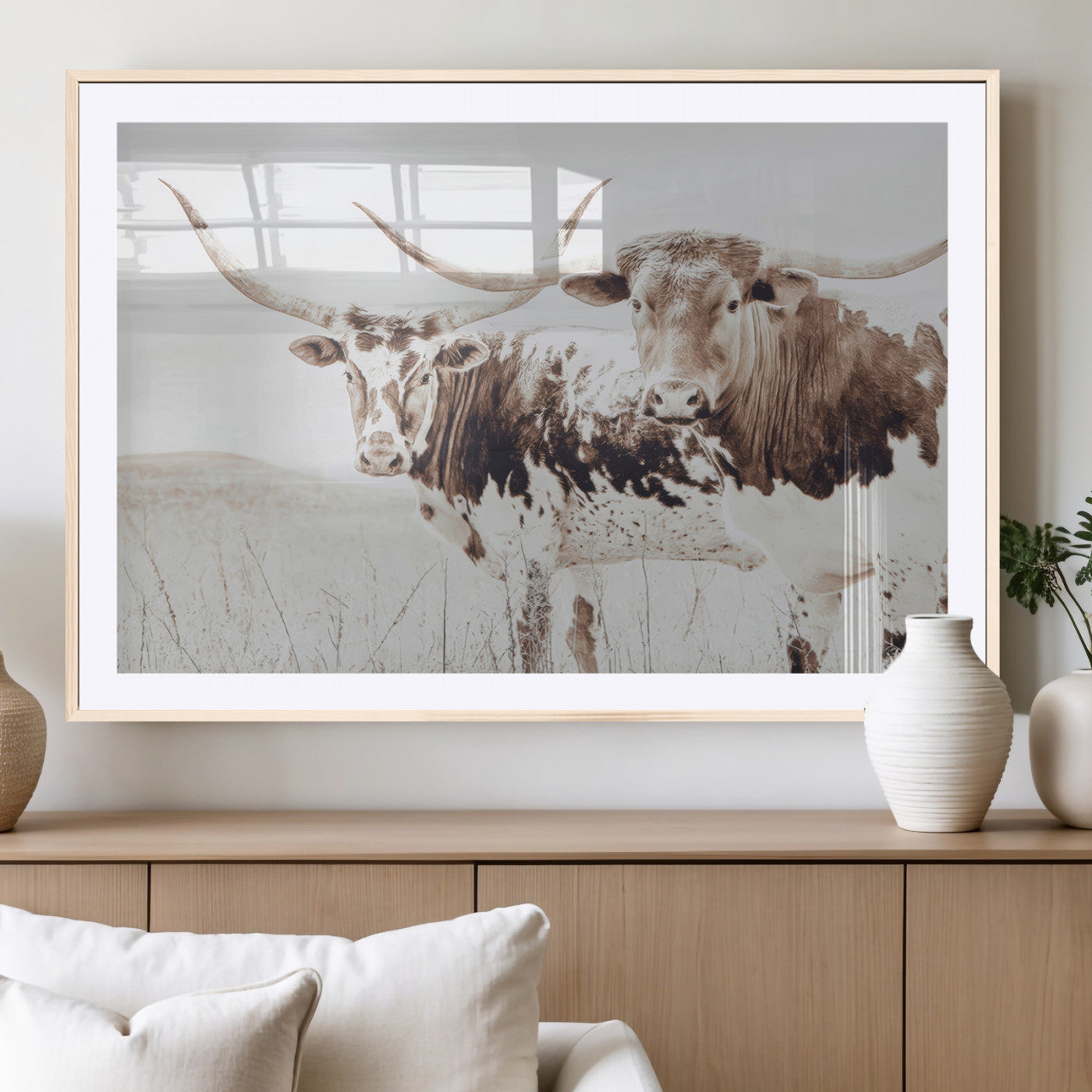 Two longhorn cows standing in a sepia-toned pasture with soft light, ideal for rustic or farmhouse-themed neutral wall decor.