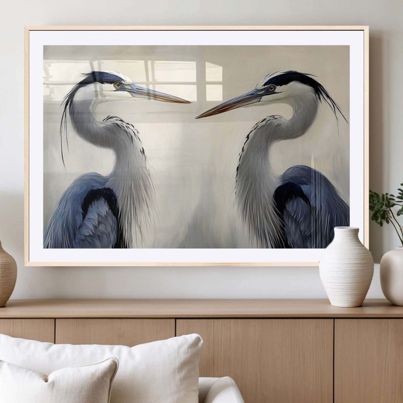 Two blue herons facing each other on a soft neutral background, ideal for coastal, tranquil, or nature-inspired minimalist interiors.