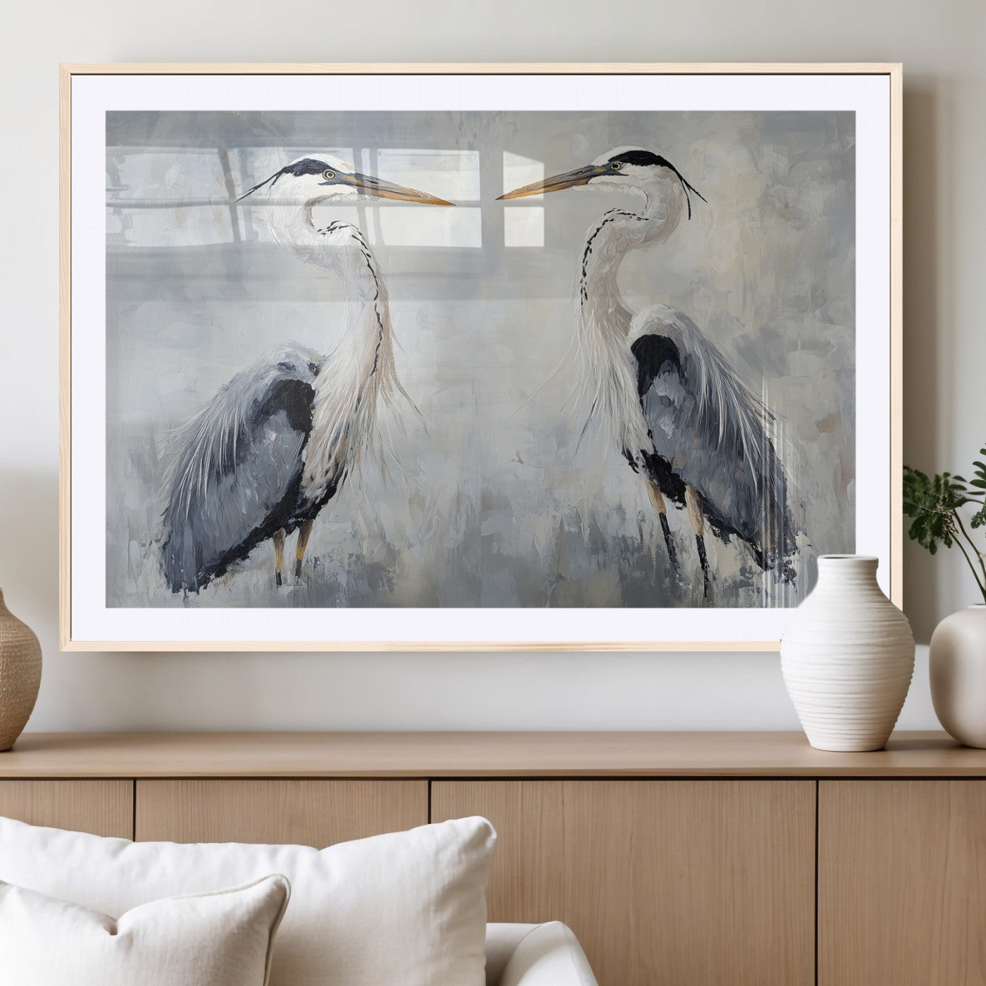 Two herons facing each other on a soft-toned background with blue-grey feathers, perfect for tranquil, coastal or nature-themed interiors.