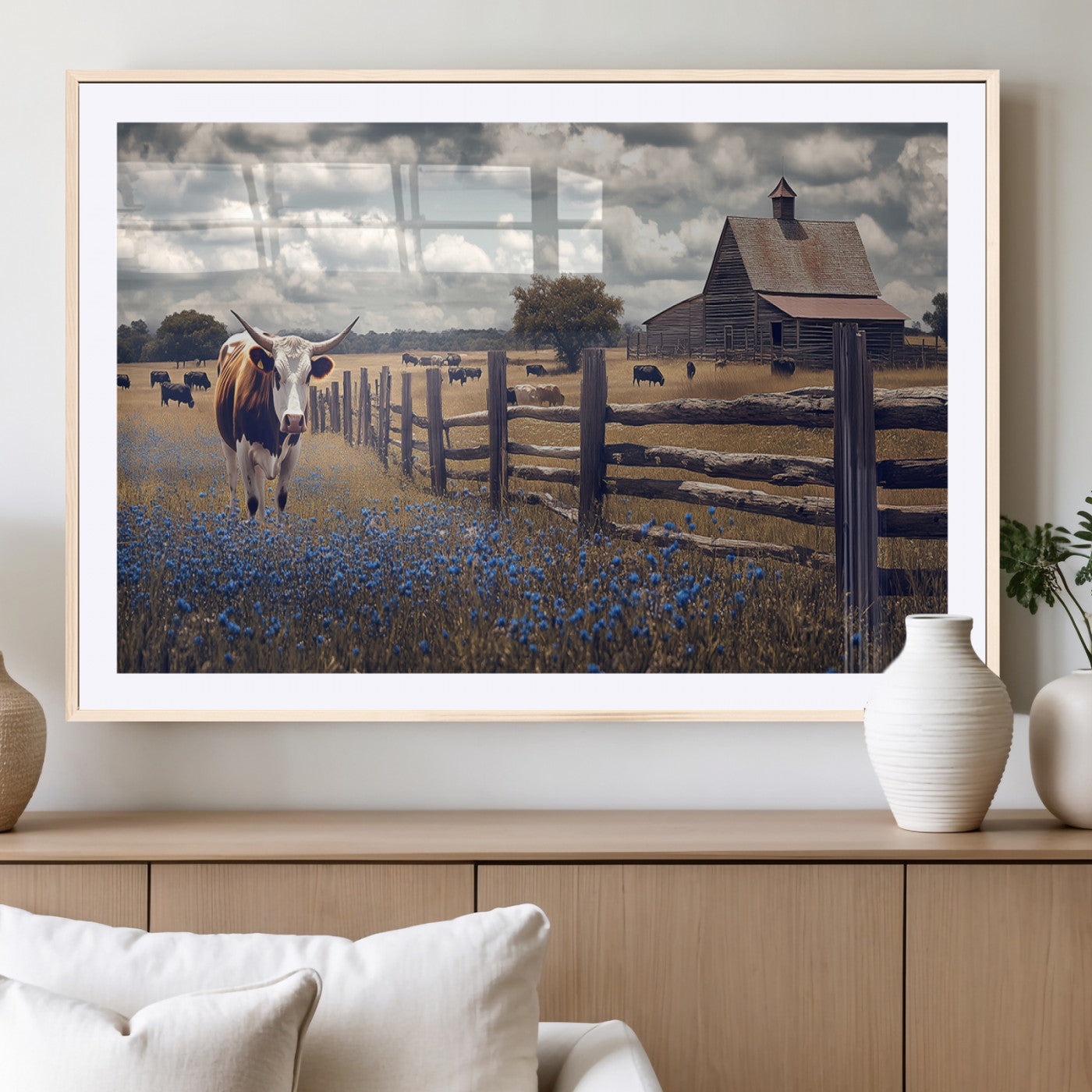 Framed canvas print of a Texas Longhorn near a rustic barn and fence, ideal for farmhouse or western-style home wall decor.