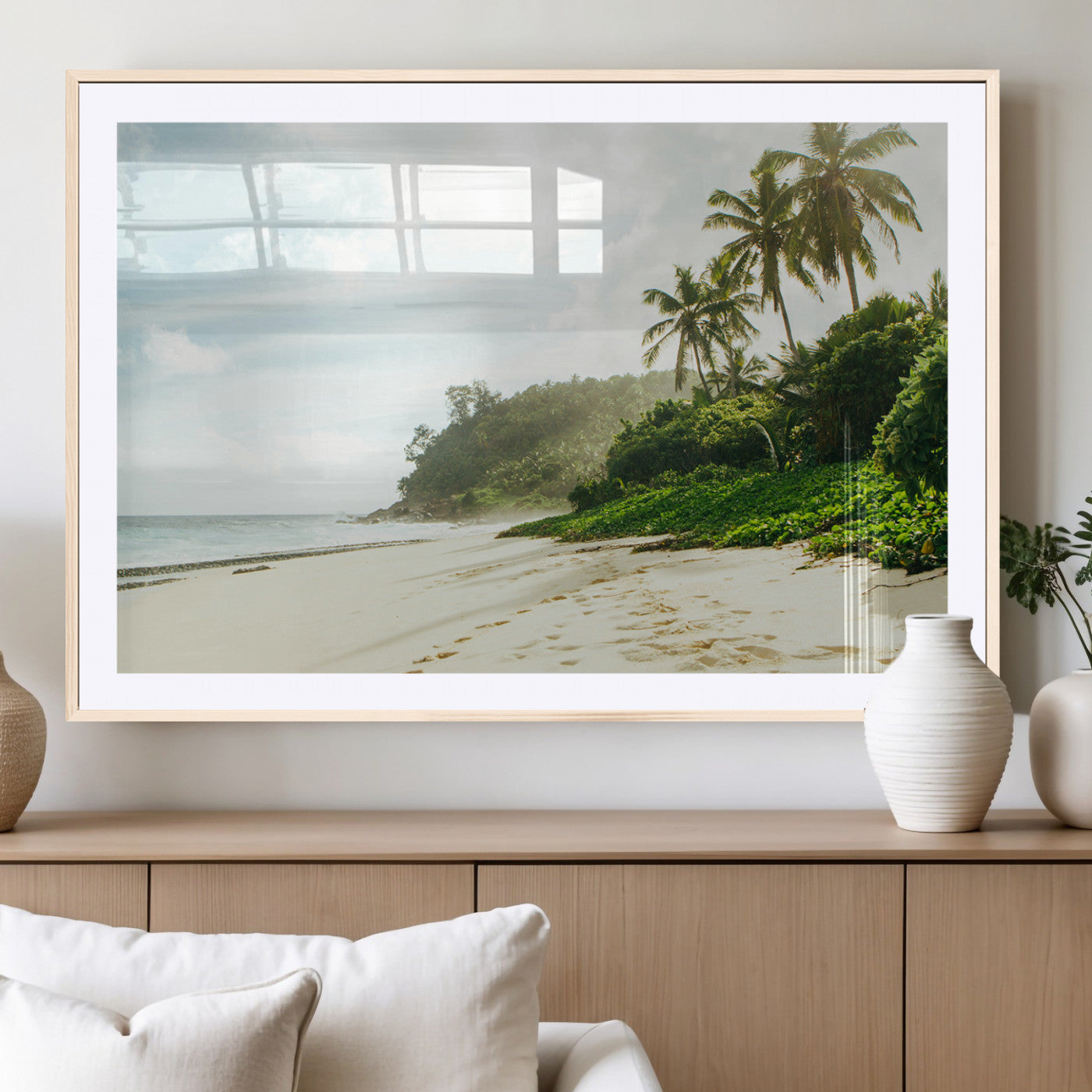 A tropical beach with palm trees, soft sand, and ocean waves under a bright sky, creating a peaceful and relaxing coastal view.