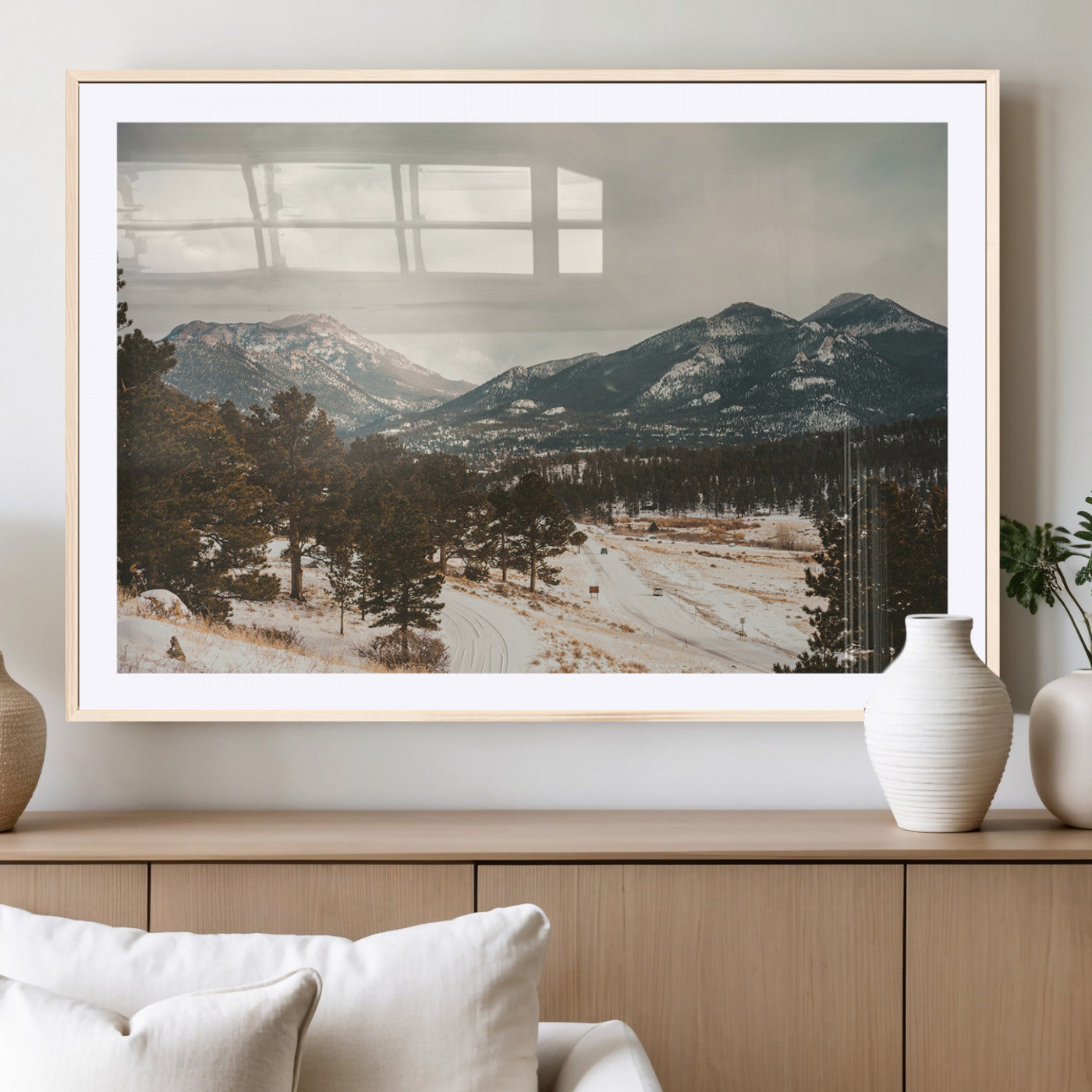 Snow-covered mountains with pine trees and a winding path, creating a serene and rustic winter landscape perfect for cozy decor.