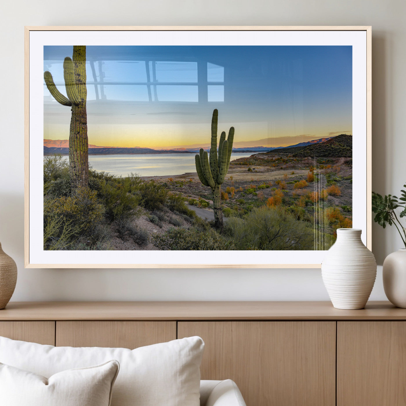 Desert landscape with saguaro cacti and lake at sunset, featuring vibrant sky and hills, ideal for Southwestern or rustic wall decor.