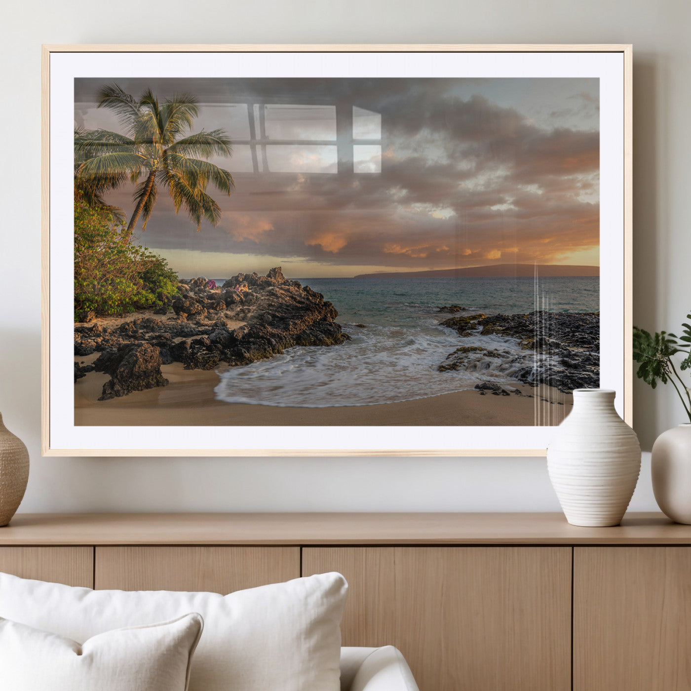 Golden sunset over a tropical beach with palm trees, rocky shoreline, and gentle ocean waves, perfect for coastal and island-inspired decor.
