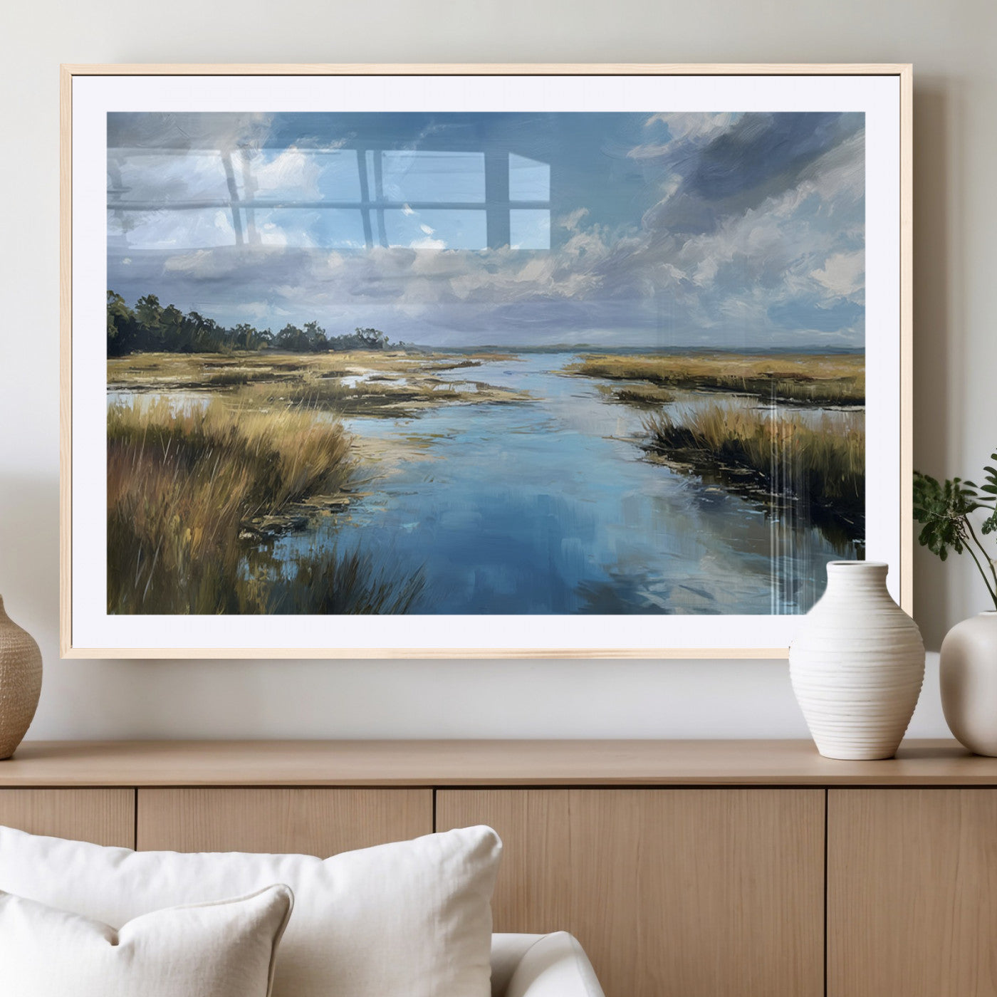 A beautiful, painterly landscape of a calm river winding through a marsh, with vibrant green grasses and a bright blue sky filled with fluffy clouds.