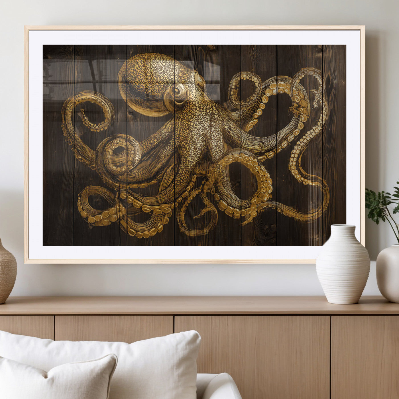 An artistic rendering of an octopus in gold ink on wooden planks, showcasing intricate details of its tentacles and textured skin.