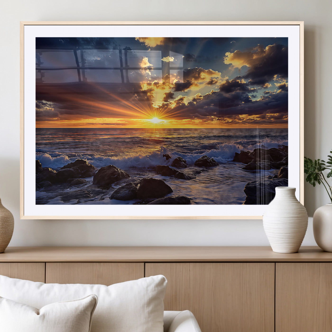 An explosive sunset over the ocean with dramatic clouds and rays of sunlight reflecting off the water, creating a vibrant and captivating view.
