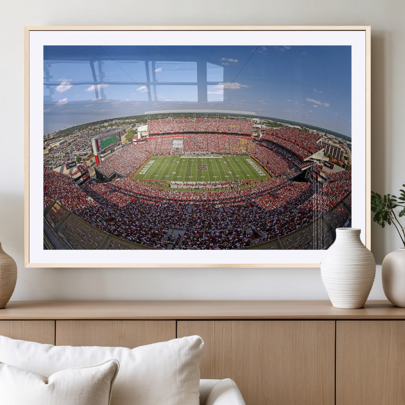 An William Brice-Stadium view of a full football stadium with cheering fans and clear blue skies, capturing the excitement and energy of the game.