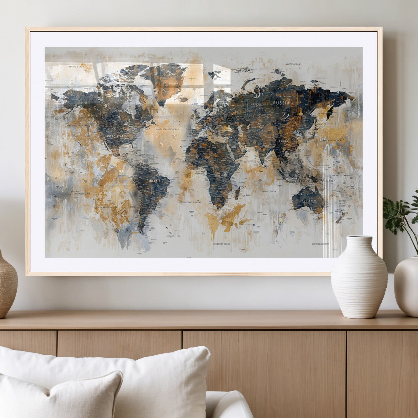 Artistic world map with textured brush strokes in shades of gold, navy blue, and white, showing continents and countries with an abstract, painterly effect.