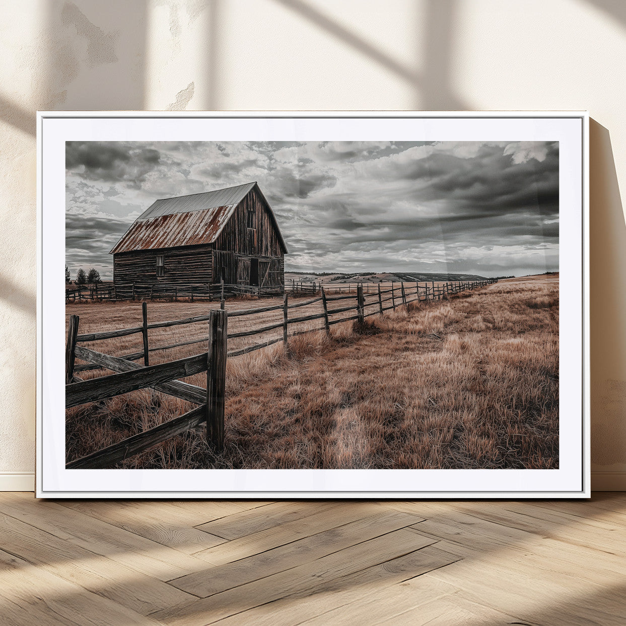 Framed canvas of a rustic barn under a moody sky with weathered fence and dark fields, ideal for farmhouse or rural-style wall decor.