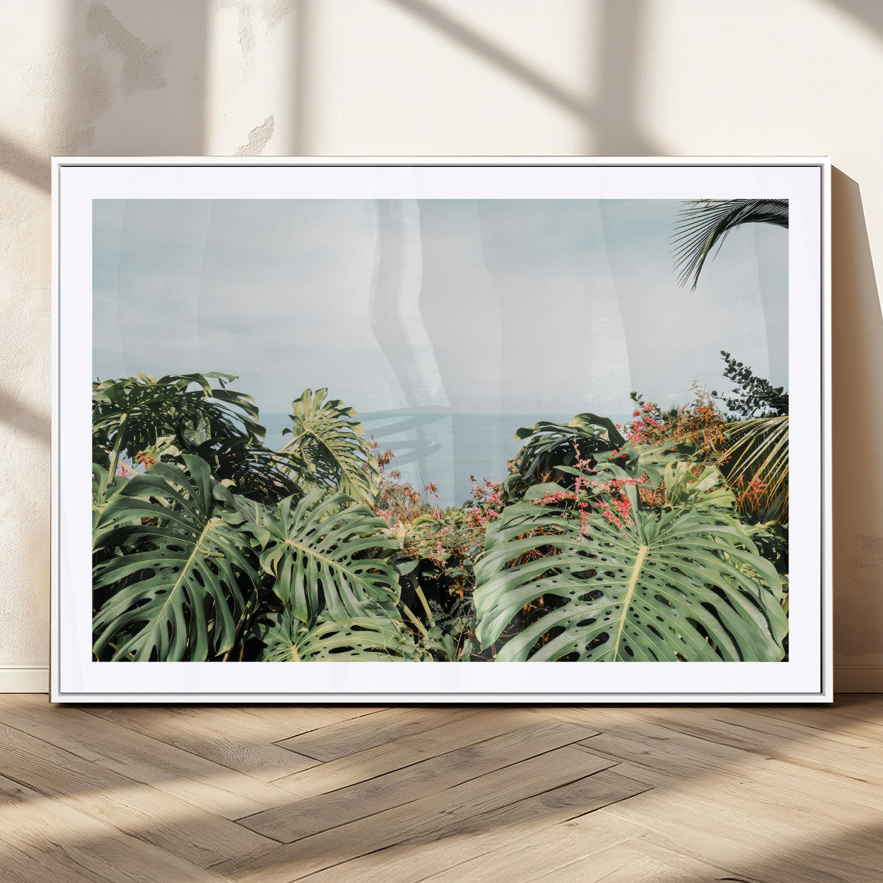 45700479-MGV-CV-36X24 - Tropical Greenery Wall Art – Exotic Leaves & Ocean View Canvas Print, Sunlit Paradise and Vibrant Nature for Living Room or Coastal Decor