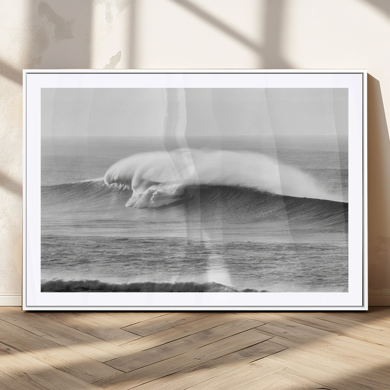 A dramatic black and white ocean wave crashing with immense force, capturing the raw power and movement of the sea in a bold seascape.