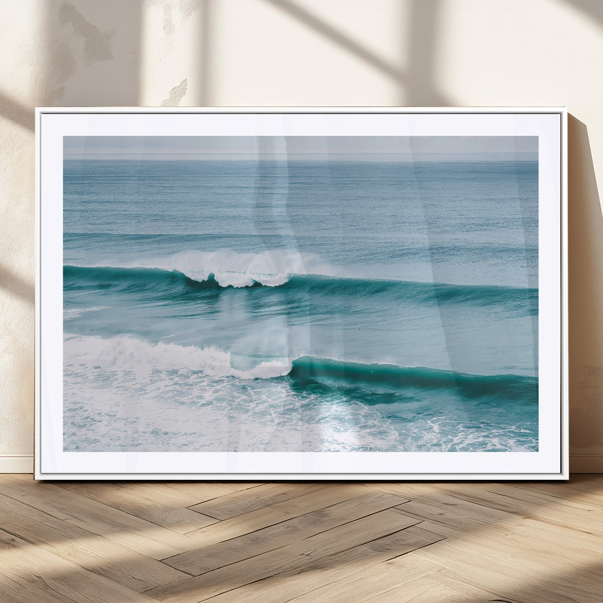Powerful ocean waves rolling towards the shore, their turquoise hues blending with white sea foam under an open horizon, capturing the essence of the ocean's movement.