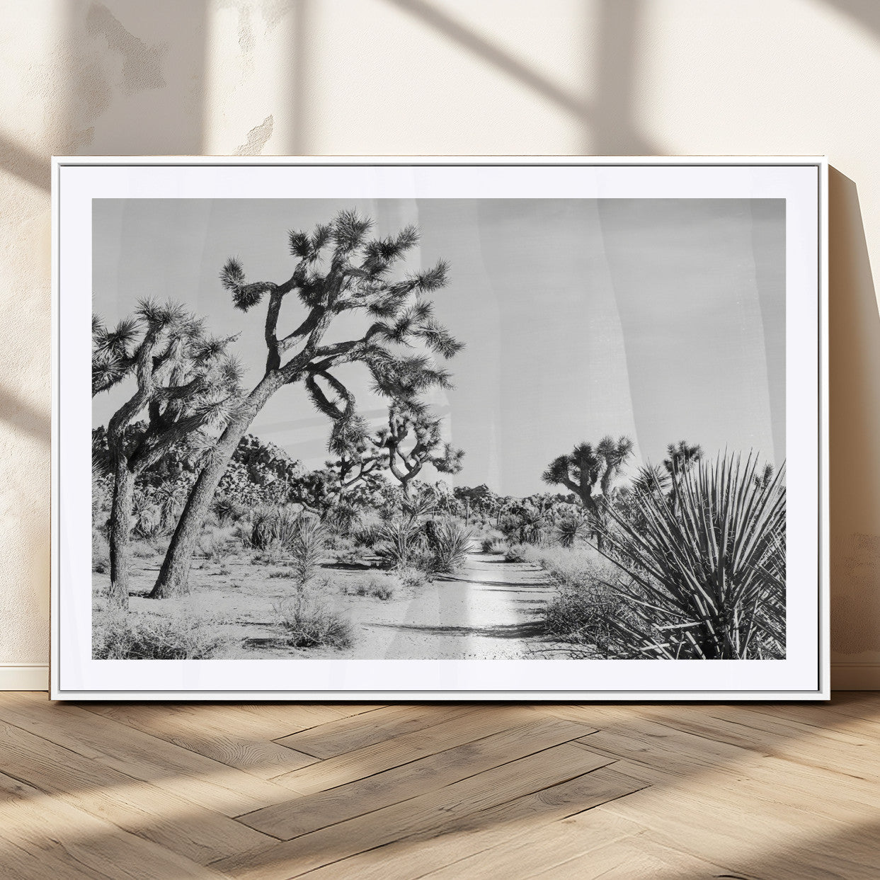 Canvas of a Joshua Tree forest in black and white tones, featuring a desert path and spiky vegetation, ideal for minimalist or rustic decor.