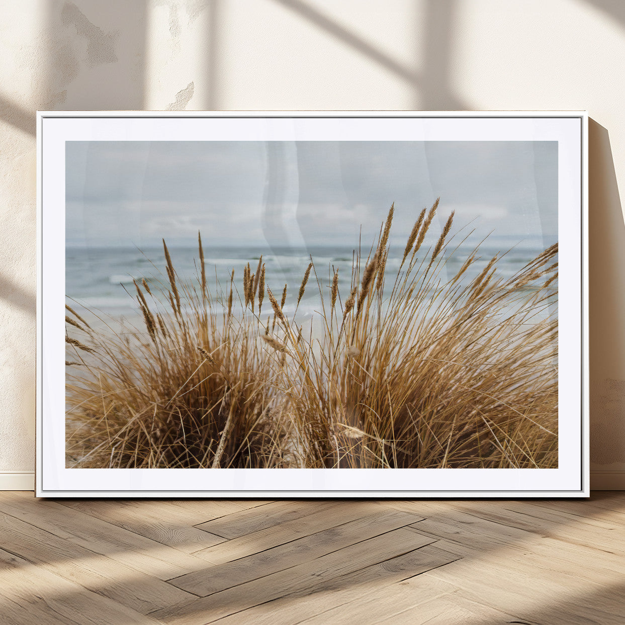 Canvas of golden beach grass swaying by the ocean under a soft cloudy sky, perfect for neutral-toned or coastal minimalist decor.