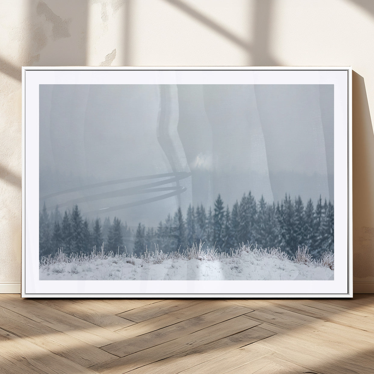 Snow-covered forest under misty sky, soft light breaking through clouds, ideal for minimalist or Nordic-inspired home decor.